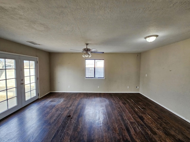 spare room with visible vents, french doors, baseboards, and hardwood / wood-style flooring