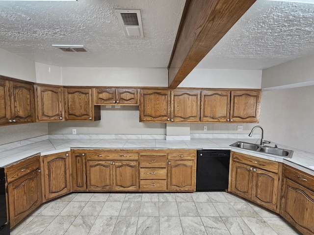 kitchen with dishwasher, brown cabinetry, visible vents, and a sink