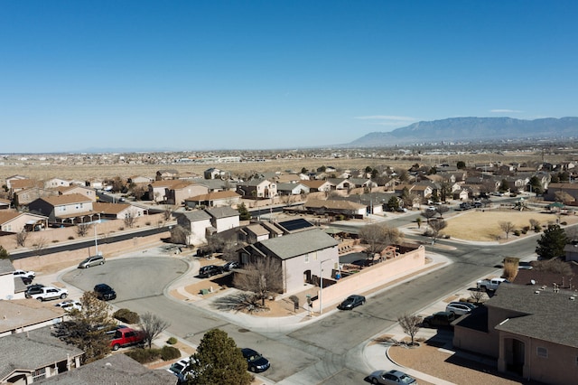 drone / aerial view featuring a residential view and a mountain view