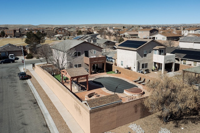 birds eye view of property with a residential view