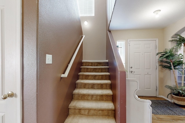 stairs with wood finished floors