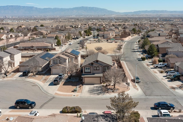 birds eye view of property featuring a mountain view and a residential view