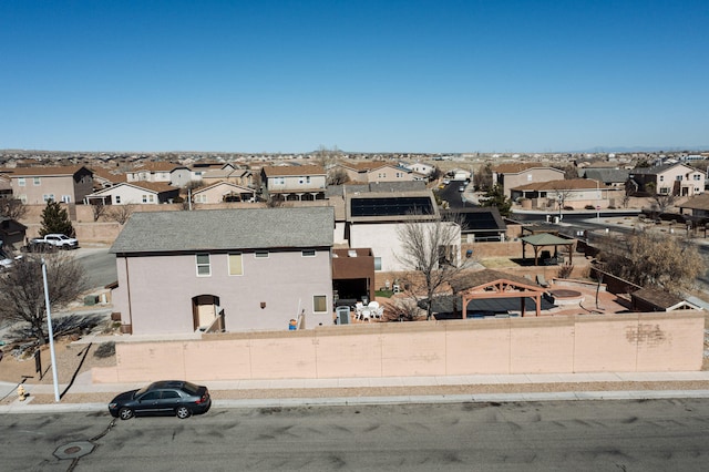 birds eye view of property with a residential view