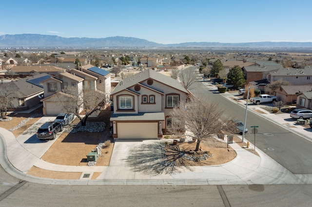 drone / aerial view with a mountain view and a residential view