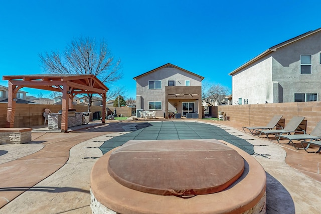 view of swimming pool featuring a patio area, a fenced backyard, and a fenced in pool