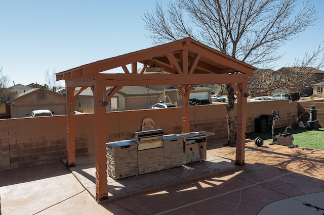 view of patio / terrace featuring fence