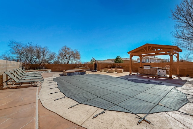 view of pool with a gazebo, an outdoor fire pit, a fenced backyard, and a patio