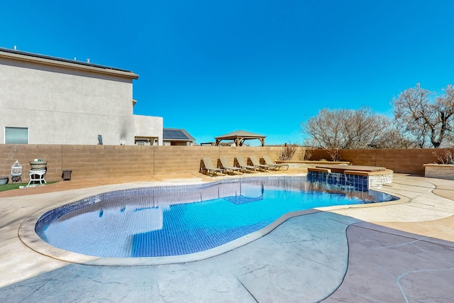 view of swimming pool featuring a patio area, a fenced backyard, and a fenced in pool