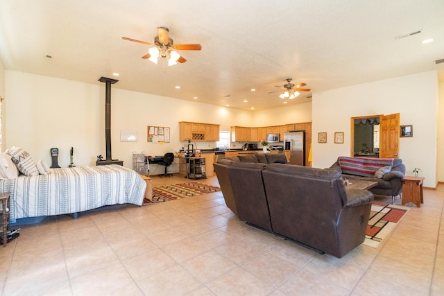 living room with light tile patterned floors, ceiling fan, visible vents, and recessed lighting