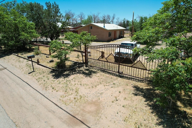 view of gate with fence