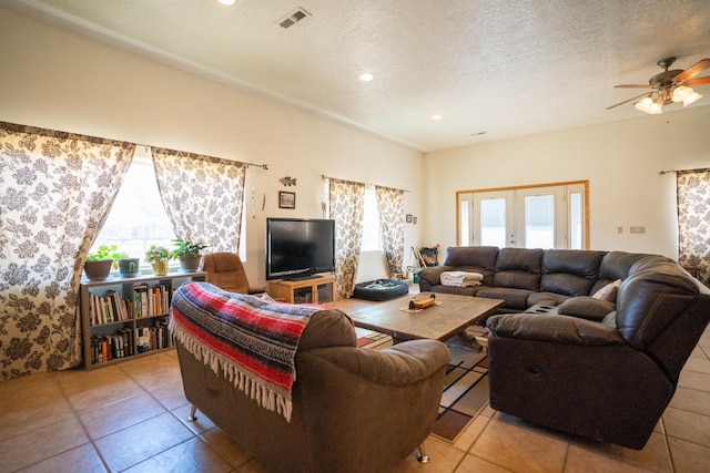 living room featuring visible vents, tile patterned floors, a textured ceiling, french doors, and recessed lighting