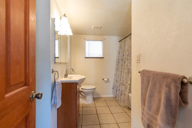 bathroom featuring tile patterned flooring, toilet, shower / tub combo, visible vents, and vanity