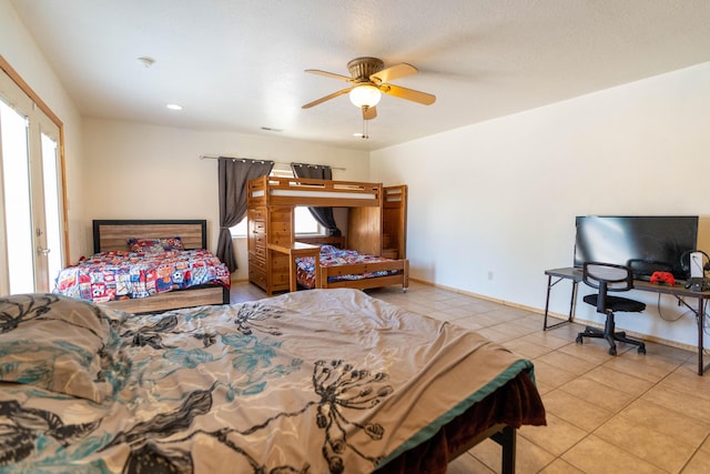 bedroom featuring tile patterned flooring, ceiling fan, and baseboards