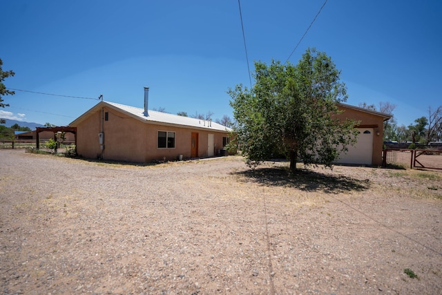 exterior space featuring fence and stucco siding