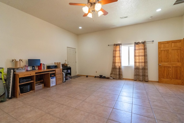 office area featuring baseboards, visible vents, a ceiling fan, and light tile patterned flooring