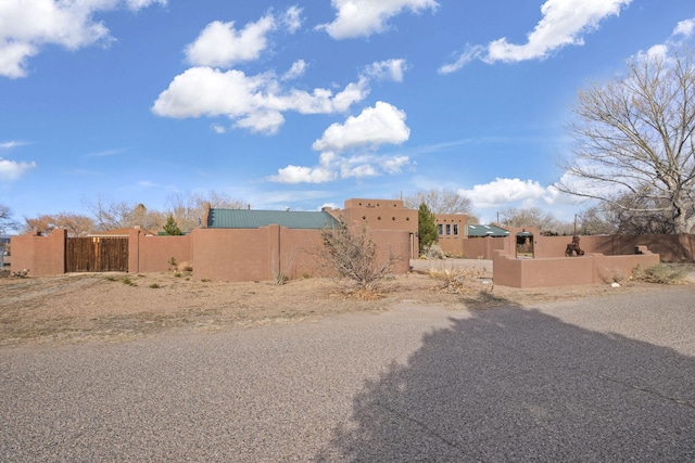 view of yard featuring a fenced front yard and a gate