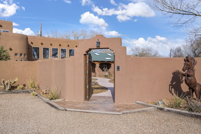 view of gate featuring a fenced front yard