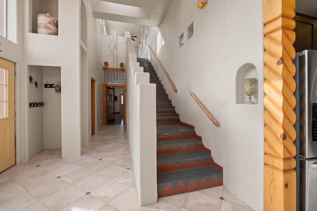 stairs with a towering ceiling