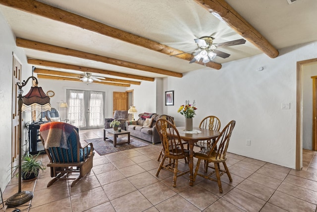 dining room featuring french doors, light tile patterned floors, ceiling fan, a textured ceiling, and beamed ceiling