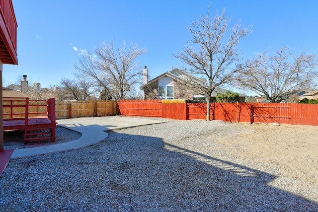 view of yard with a patio area and a fenced backyard