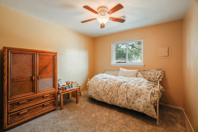 bedroom featuring visible vents, carpet flooring, ceiling fan, a textured ceiling, and baseboards