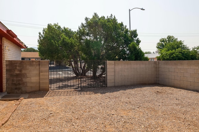 view of yard with a gate and fence