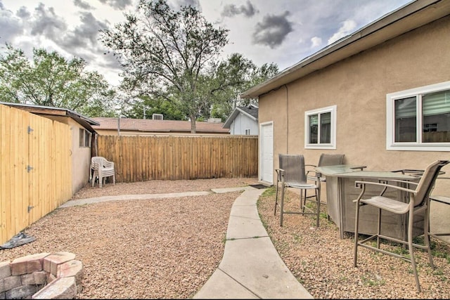 view of yard featuring a patio area and fence