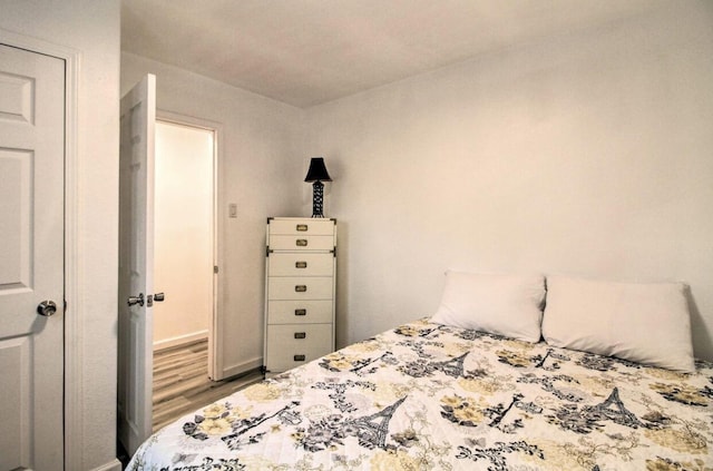 bedroom with wood finished floors