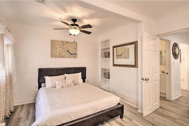 bedroom with light wood-type flooring, ceiling fan, and baseboards