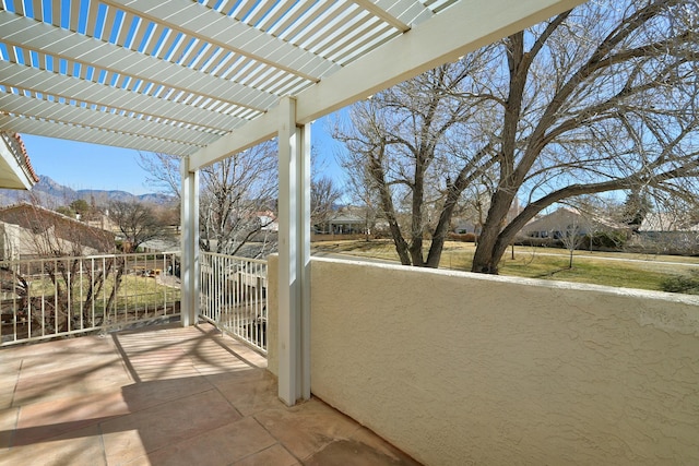 balcony with a mountain view and a pergola