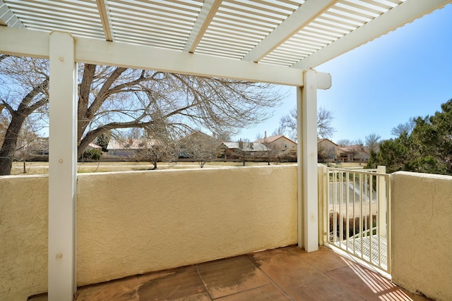 balcony featuring a pergola