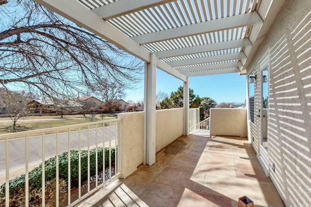 view of patio / terrace featuring a balcony and a pergola