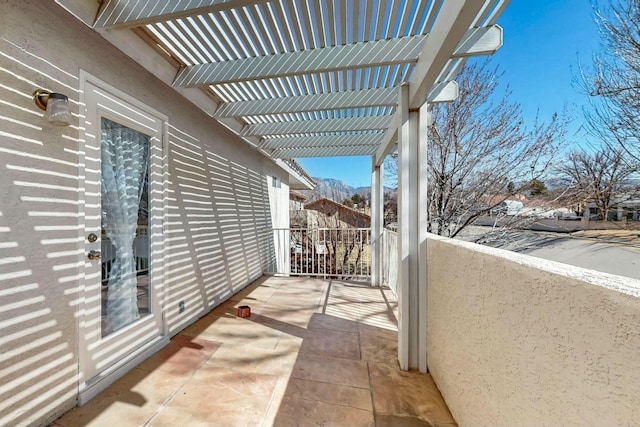 balcony featuring a pergola