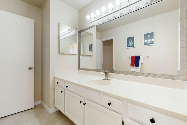 bathroom featuring baseboards and vanity