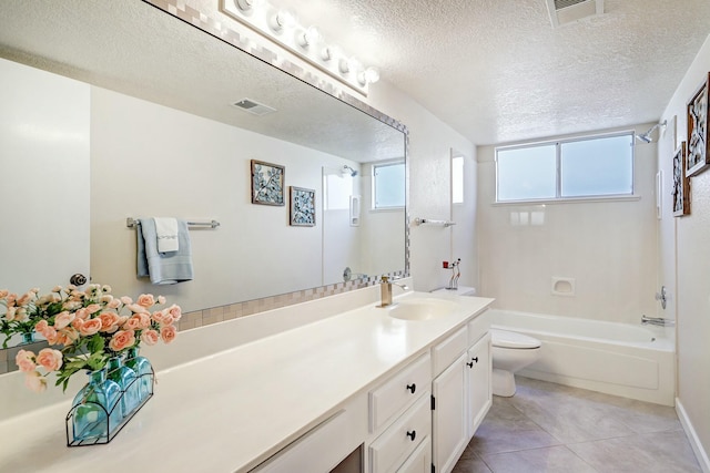 bathroom with visible vents, a textured ceiling, and toilet