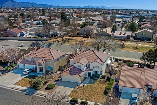 drone / aerial view featuring a mountain view and a residential view