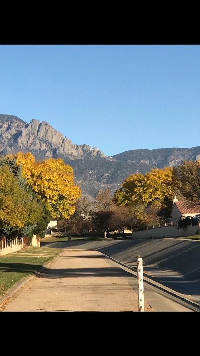 exterior space with curbs and a mountain view