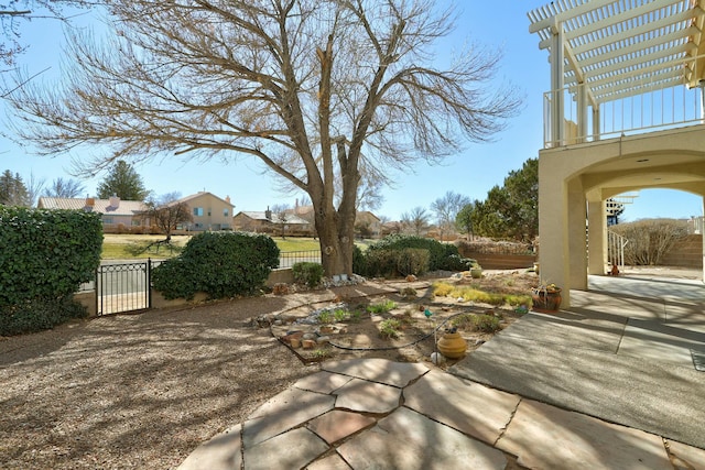 exterior space with fence and a gate