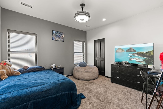 bedroom with carpet flooring, visible vents, and baseboards