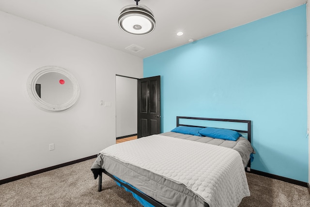 carpeted bedroom featuring recessed lighting, visible vents, and baseboards