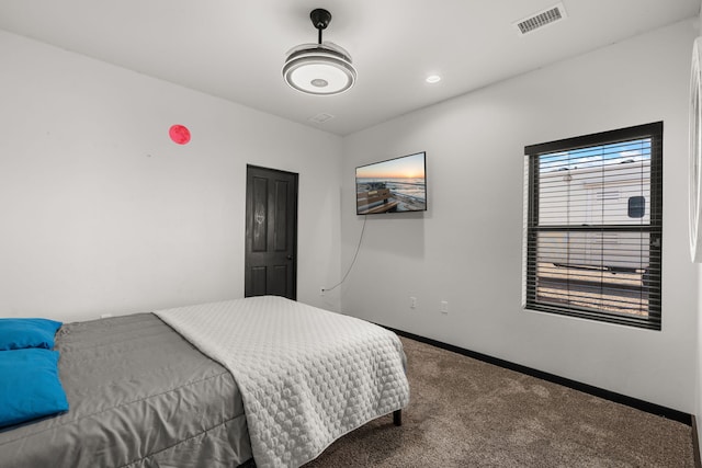 carpeted bedroom featuring recessed lighting, visible vents, and baseboards