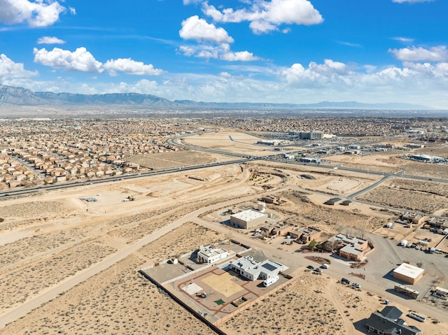 drone / aerial view with a mountain view and a desert view