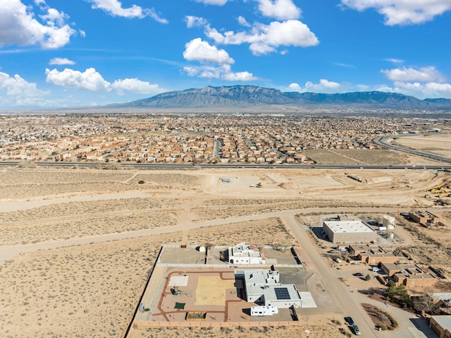 bird's eye view featuring a mountain view and view of desert