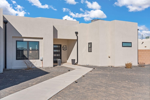 exterior space featuring stucco siding