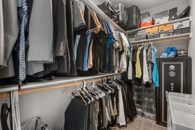 spacious closet with carpet flooring