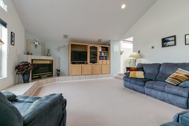 living area featuring visible vents, carpet floors, high vaulted ceiling, recessed lighting, and a fireplace