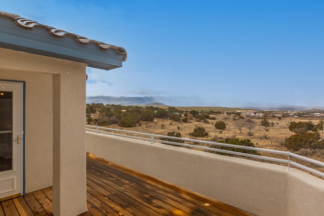 balcony featuring a mountain view