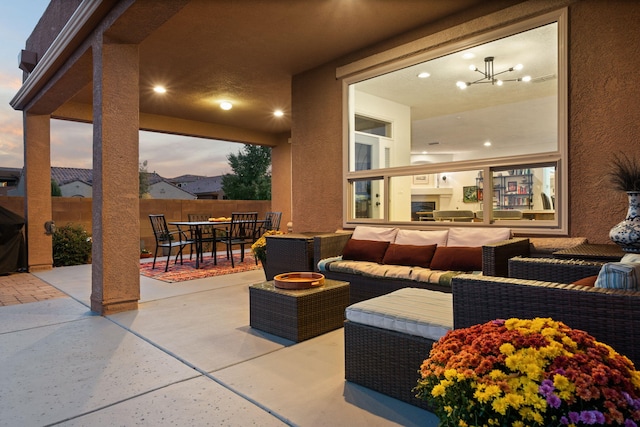 view of patio / terrace featuring outdoor dining space, an outdoor living space, and fence