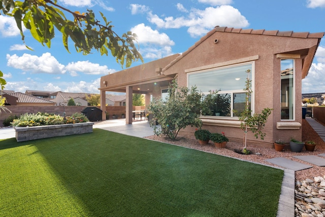 view of yard featuring a patio and fence