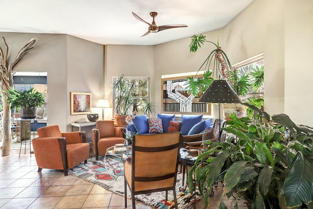 tiled living room with a ceiling fan